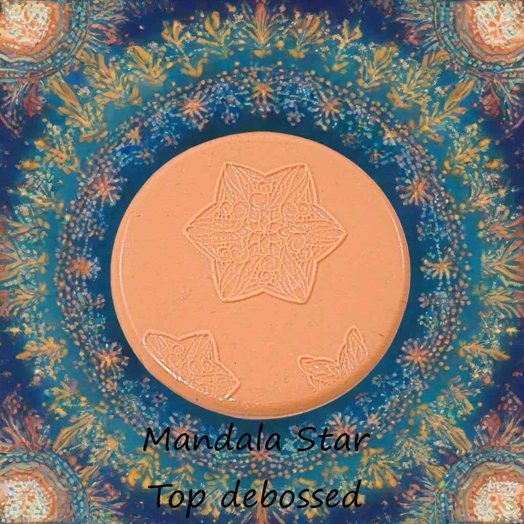 A star flower mandala embossed in silly putty Using a debossed texture mat. This will give you an idea of what it will look like on metal clay or polymer clay.