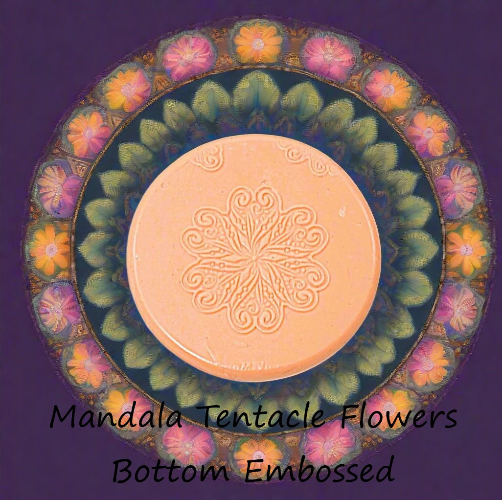 A flower mandala debossed in silly putty Using a embossed texture mat. This will give you an idea of what it will look like on metal clay or polymer clay.
