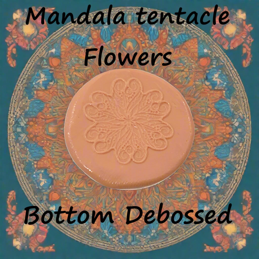 A flower mandala embossed in silly putty Using a debossed texture mat. This will give you an idea of what it will look like on metal clay or polymer clay.