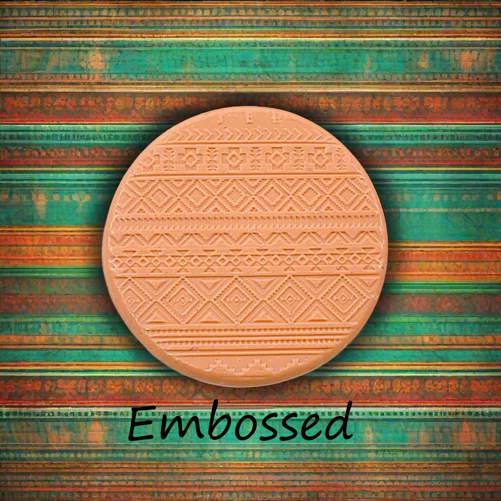 A pattern debossed in silly putty Using a Mexican border embossed texture mat. This will give you an idea of what it will look like on metal clay or polymer clay.
