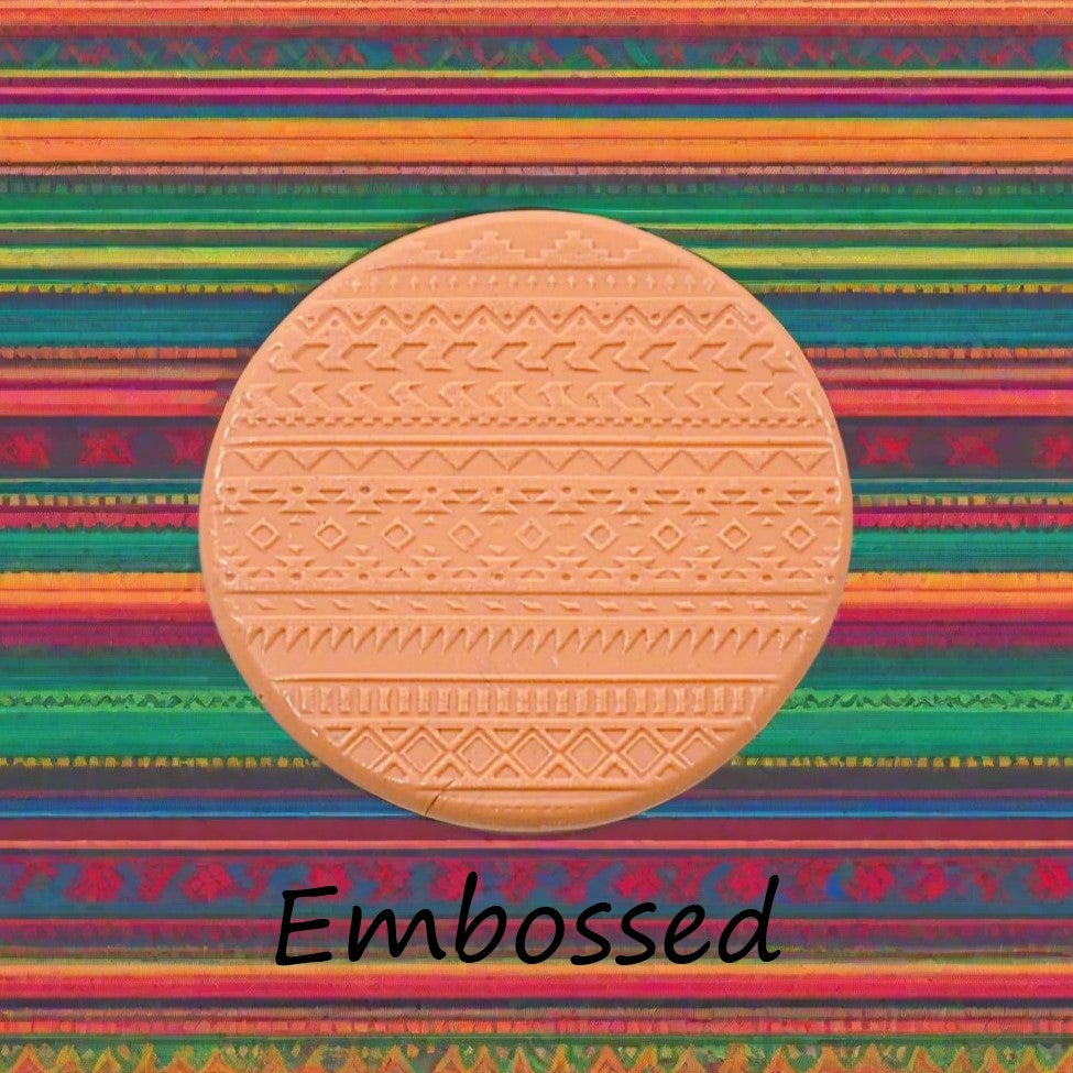 A pattern debossed in silly putty Using a Mexican border embossed texture mat. This will give you an idea of what it will look like on metal clay or polymer clay.
