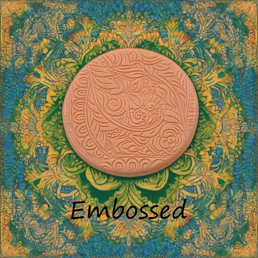 A flowery design debossed in silly putty Using a embossed texture mat. This will give you an idea of what it will look like on metal clay or polymer clay.