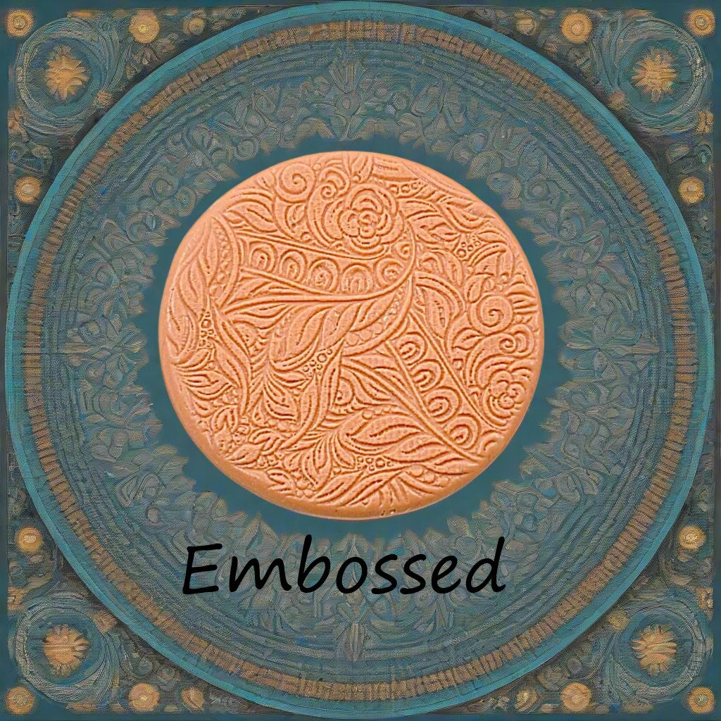 A flowery design debossed in silly putty using a embossed texture mat. This will give you an idea of what it will look like on metal clay or polymer clay.