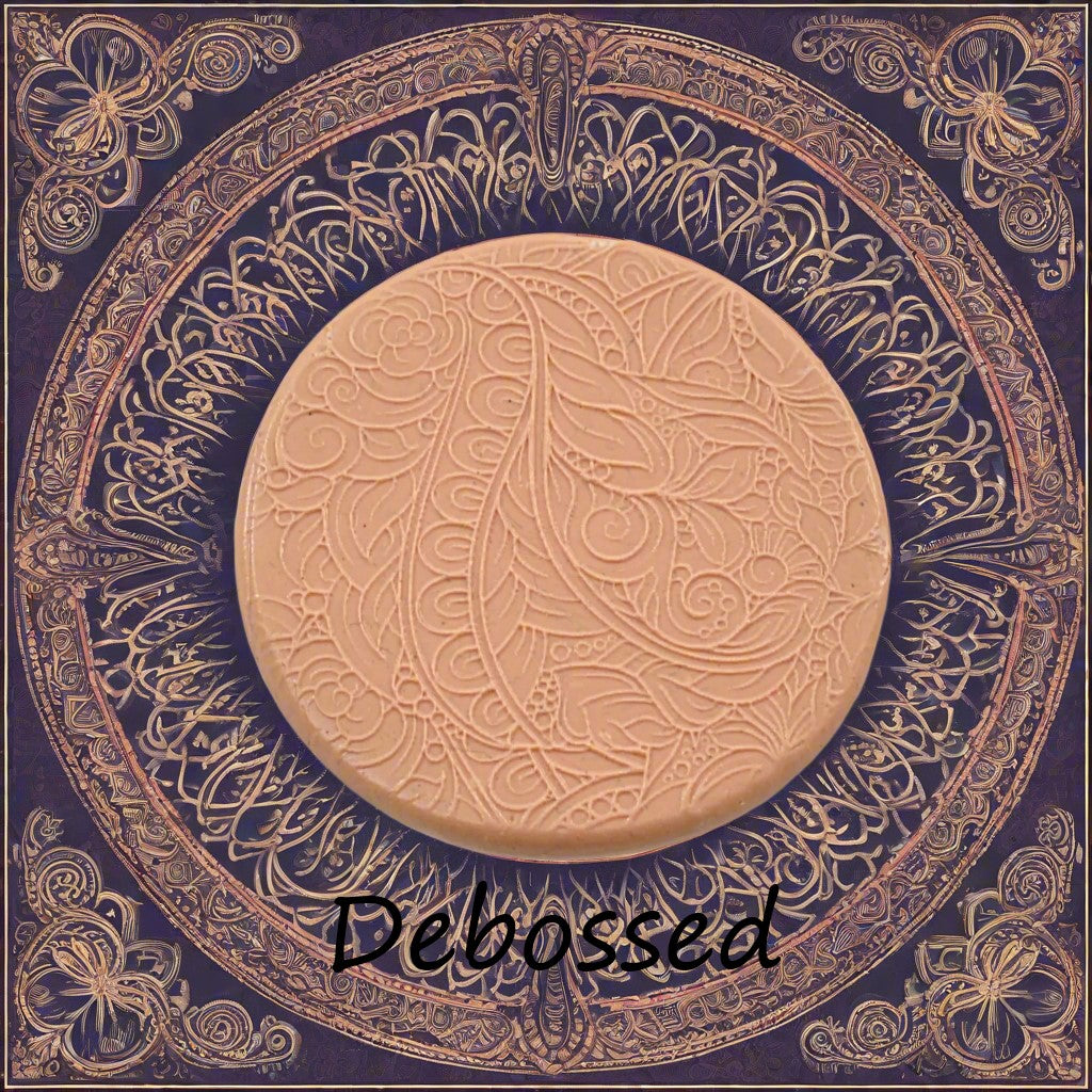 A flowery design embossed in silly putty using a debossed texture mat. This will give you an idea of what it will look like on metal clay or polymer clay.