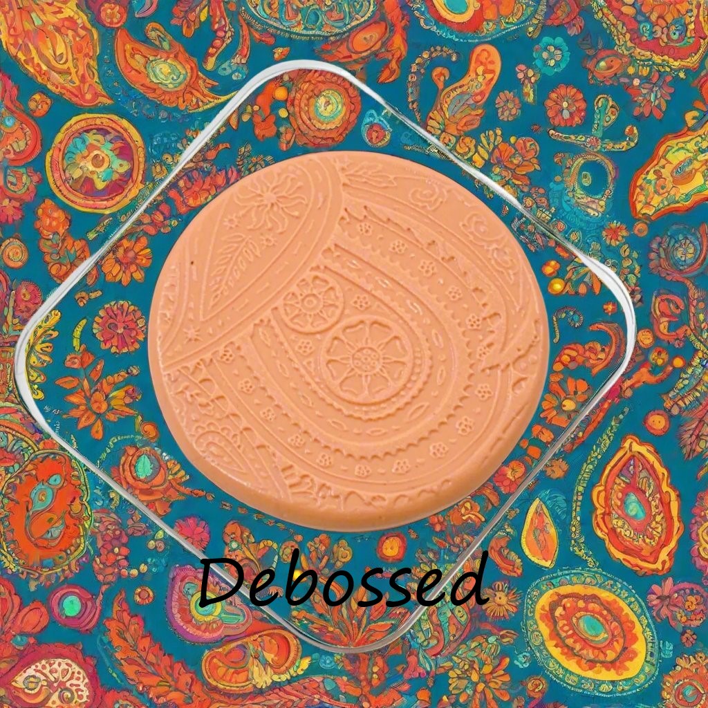 A pattern embossed in silly putty Using a patterned debossed texture mat in grey material. This will give you an idea of what it will look like on metal clay or polymer clay.