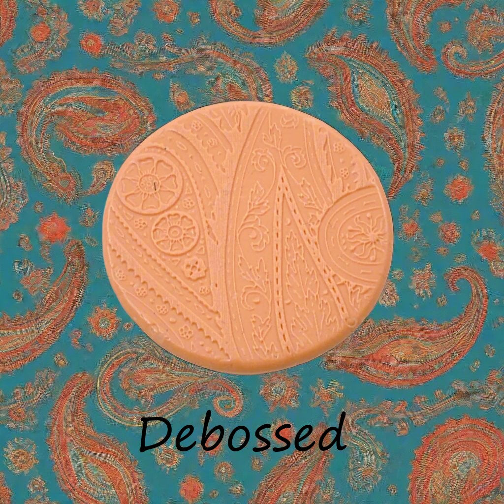 A pattern embossed in silly putty Using a patterned debossed texture mat in grey material. This will give you an idea of what it will look like on metal clay or polymer clay