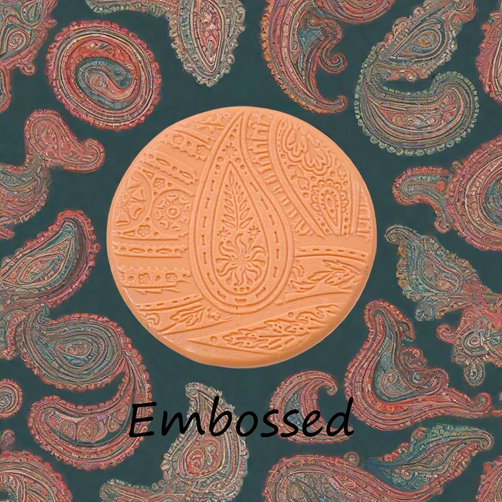 A pattern debossed in silly putty Using a patterned embossed texture mat in grey material. This will give you an idea of what it will look like on metal clay or polymer clay.