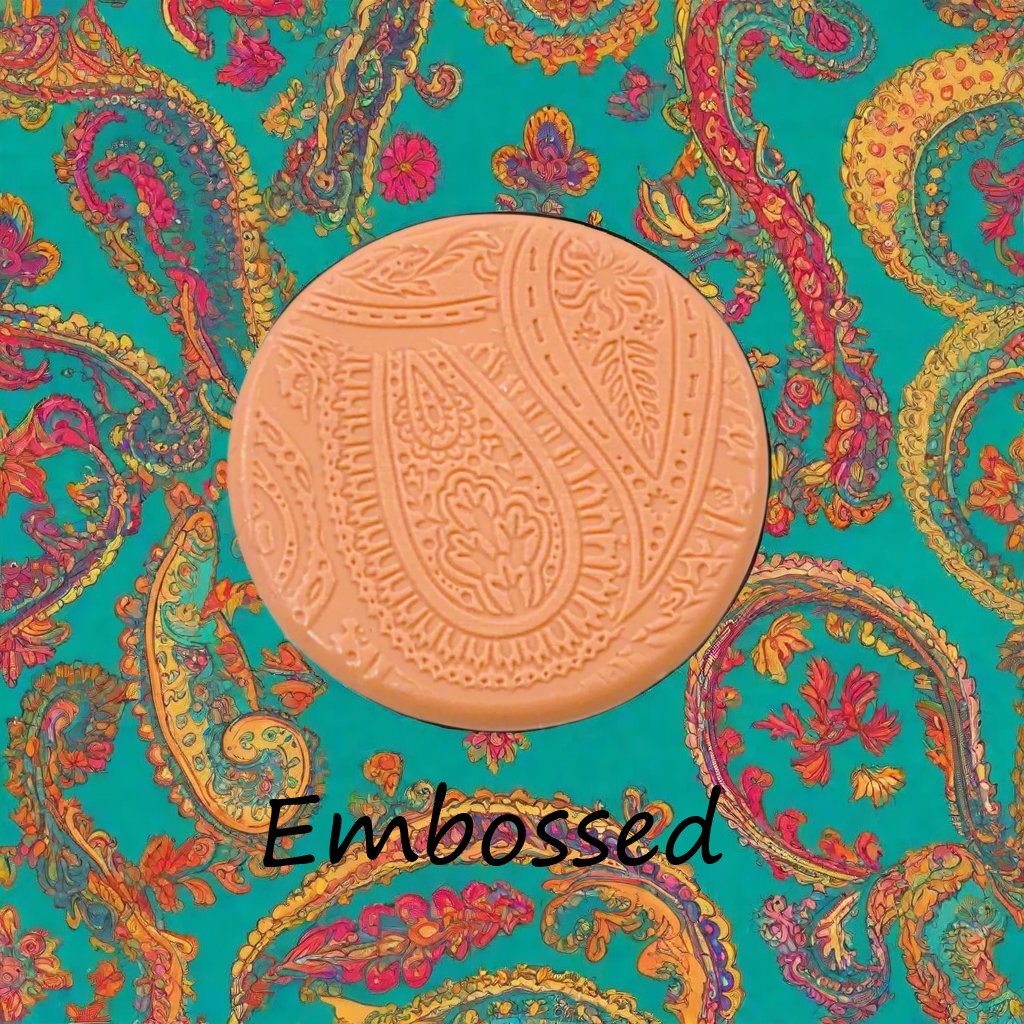 A pattern debossed in silly putty Using a patterned embossed texture mat in grey material. This will give you an idea of what it will look like on metal clay or polymer clay.