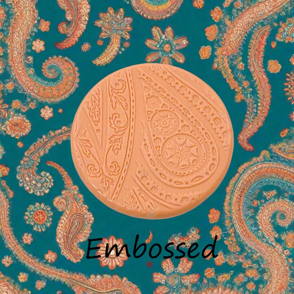 A pattern debossed in silly putty Using a patterned embossed texture mat in grey material. This will give you an idea of what it will look like on metal clay or polymer clay.