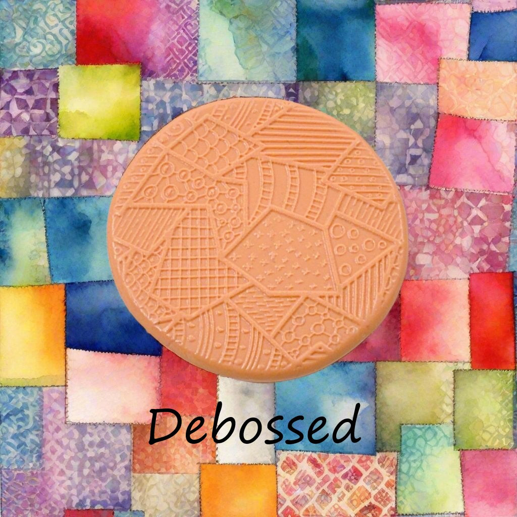 A pattern embossed in silly putty Using a patterned debossed texture mat in grey material. This will give you an idea of what it will look like on metal clay or polymer clay.