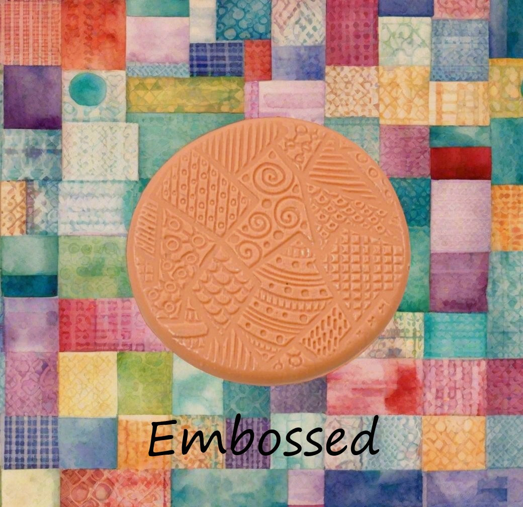 A pattern debossed in silly putty Using a patterned embossed texture mat in grey material. This will give you an idea of what it will look like on metal clay or polymer clay.