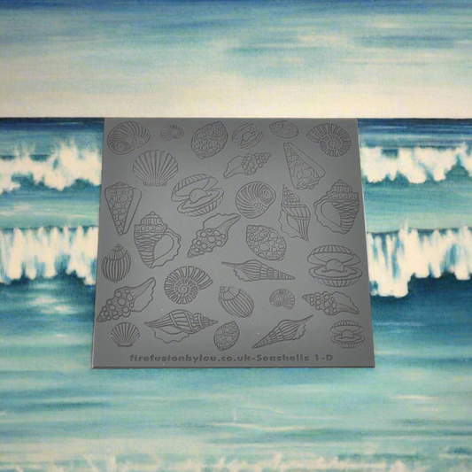 A debossed seashell texture mat with mirrored designs small and big, two sizes. use to make an impression on metal clay and polymer clay.