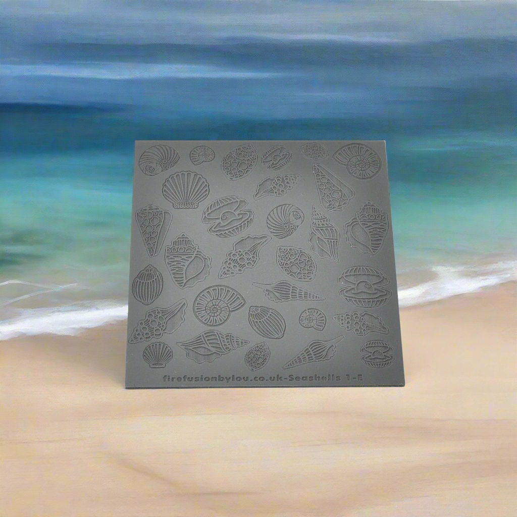 An embossed seashell texture mat with mirrored designs small and big, two sizes. use to make an impression on metal clay and polymer clay.