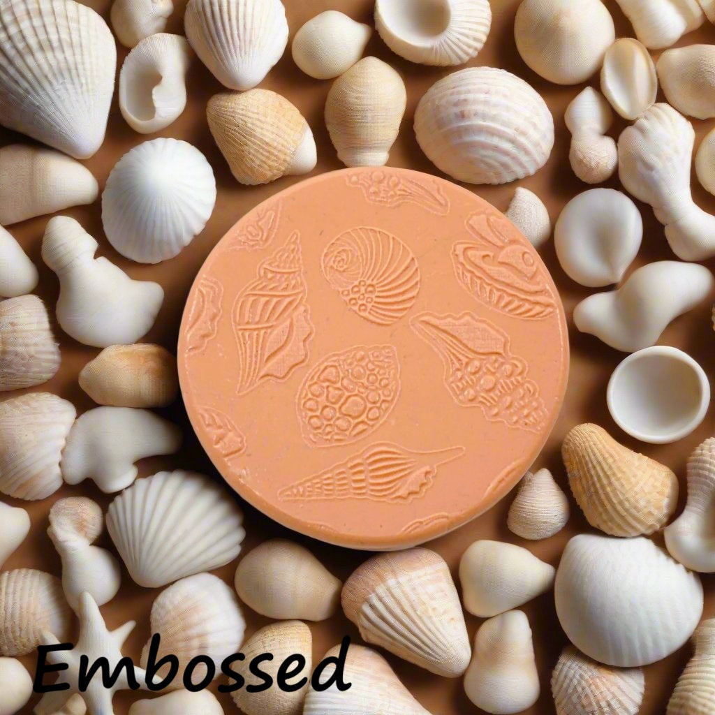 Seashells debossed in silly putty Using an embossed texture mat in grey material. This will give you an idea of what it will look like on metal clay or
