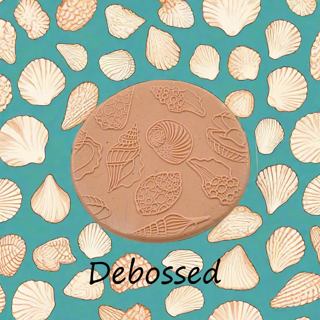 Seashells embossed in silly putty Using a debossed texture mat in grey material. This will give you an idea of what it will look like on metal clay or