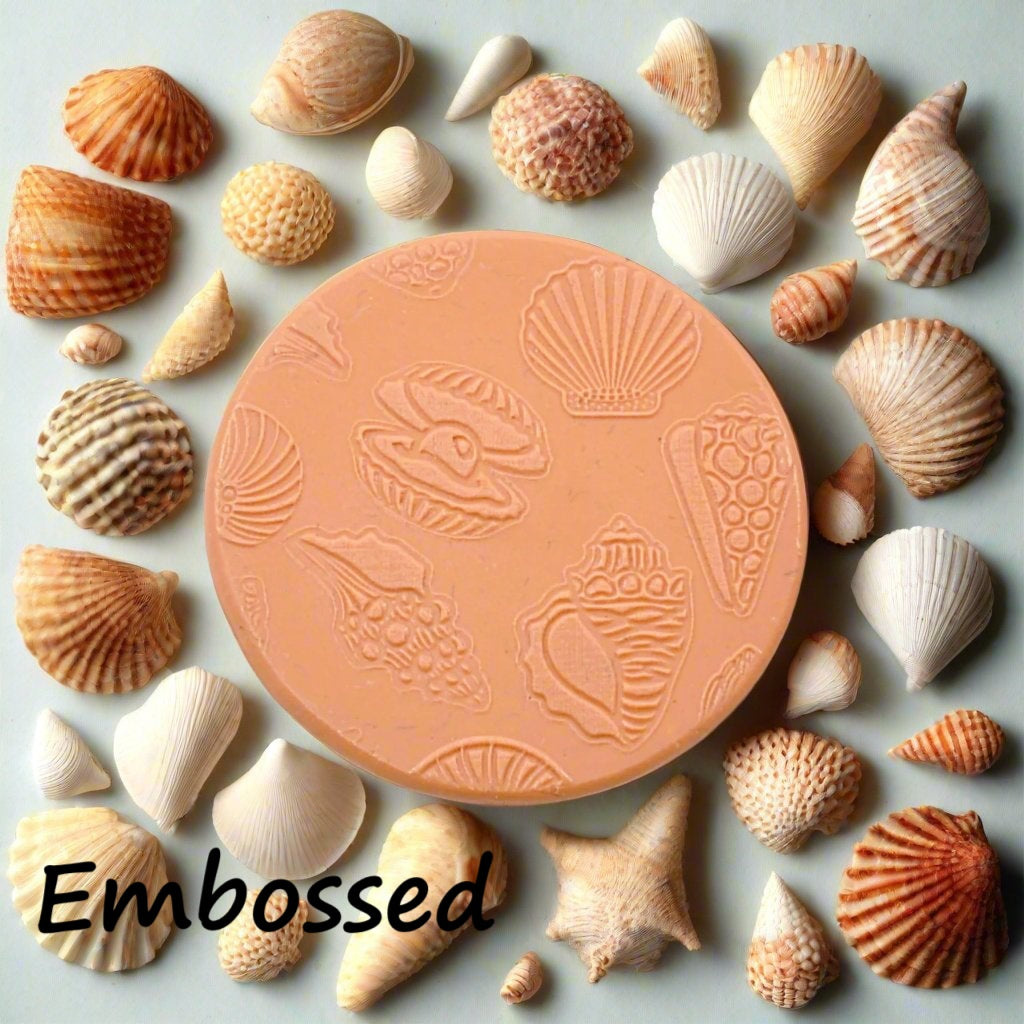 Seashells debossed in silly putty Using an embossed texture mat in grey material. This will give you an idea of what it will look like on metal clay or