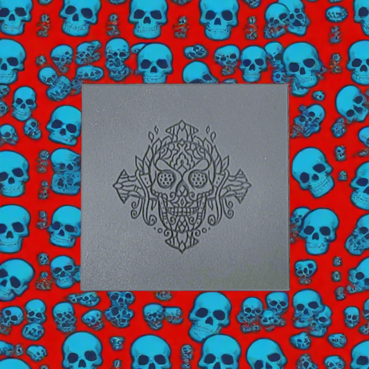 A texture tile with a debossed skull with a debossed impression of he day of dead mandala design.