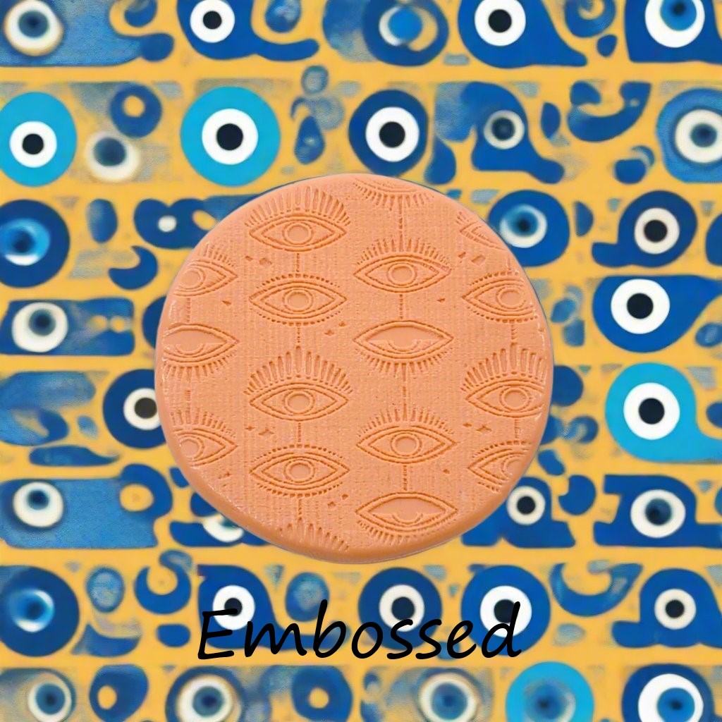 A mystical eye pattern debossed in silly putty Using a patterned embossed texture mat in grey material. This will give you an idea of what it will look like on metal clay or polymer clay.