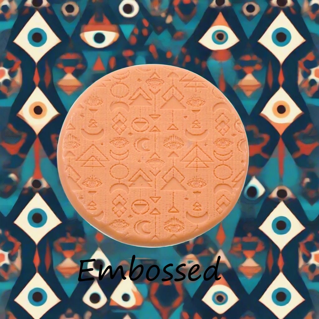 A geometric eye pattern debossed in silly putty Using a patterned embossed texture mat in grey material. This will give you an idea of what it will look like on metal clay or polymer clay.