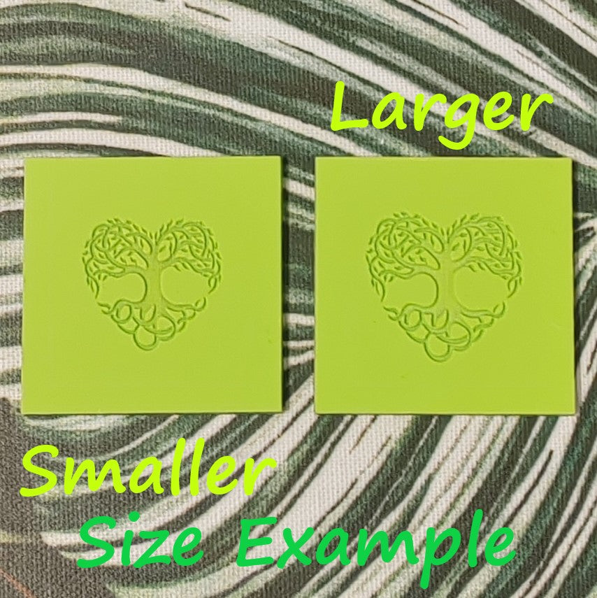 Two green square stamps with a tree of life design on a textured background.
