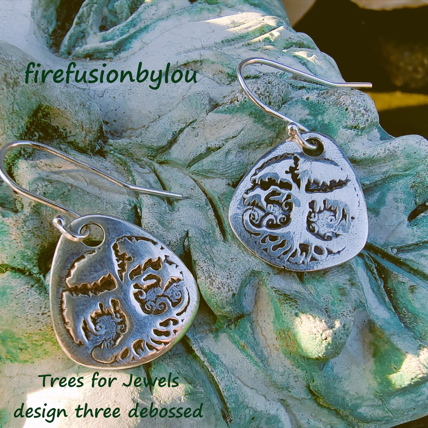 999 silver dangle earrings with a embossed tree design mad with trees for jewels texture mat three