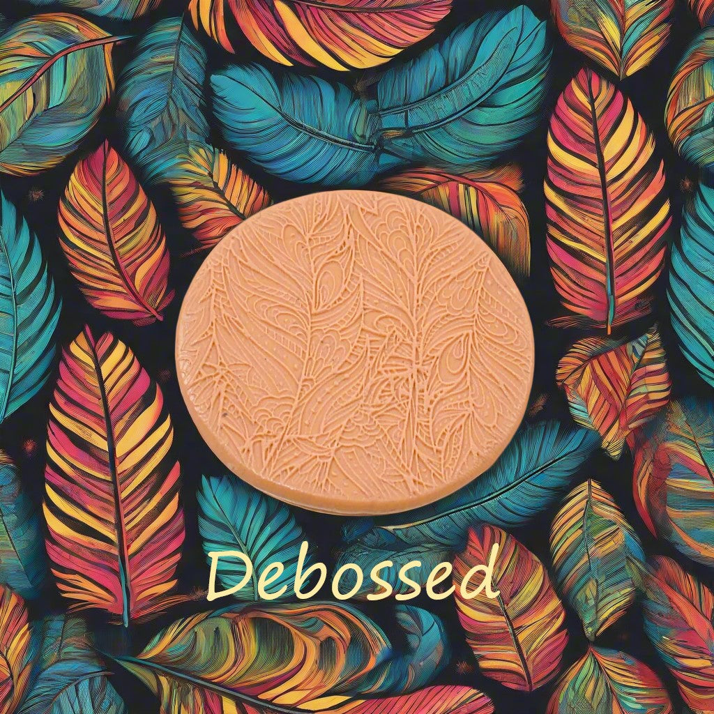 A tribal psychedelic feather pattern embossed in silly putty Using a patterned debossed texture mat in grey material. This will give you an idea of what it will look like on metal clay or polymer clay.