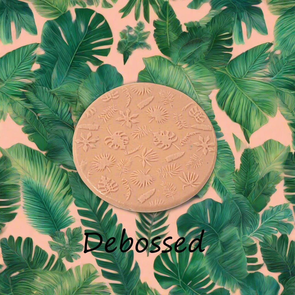 tropical leaves embossed in silly putty Using a debossed texture mat. This will give you an idea of what it will look like on metal clay or polymer clay.