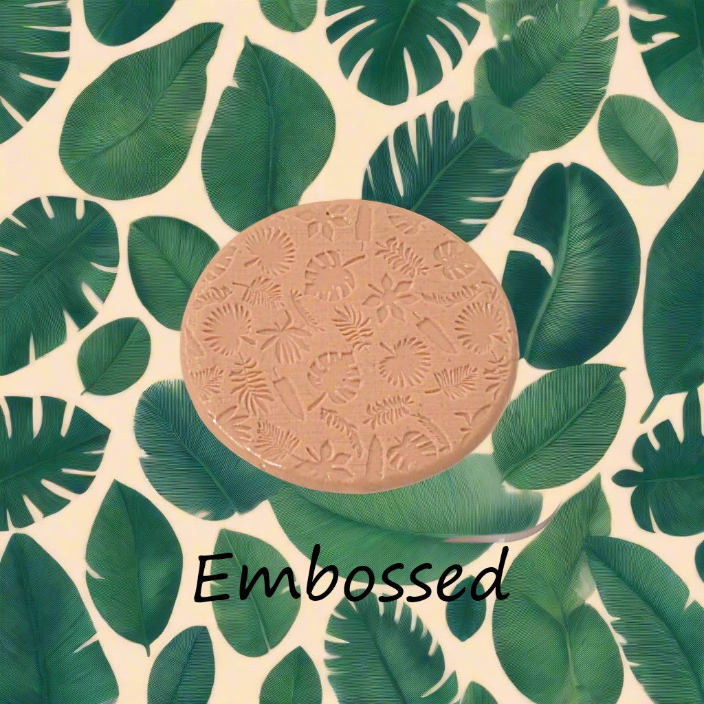 tropical leaves debossed in silly putty Using a debossed texture mat. This will give you an idea of what it will look like on metal clay or polymer clay.