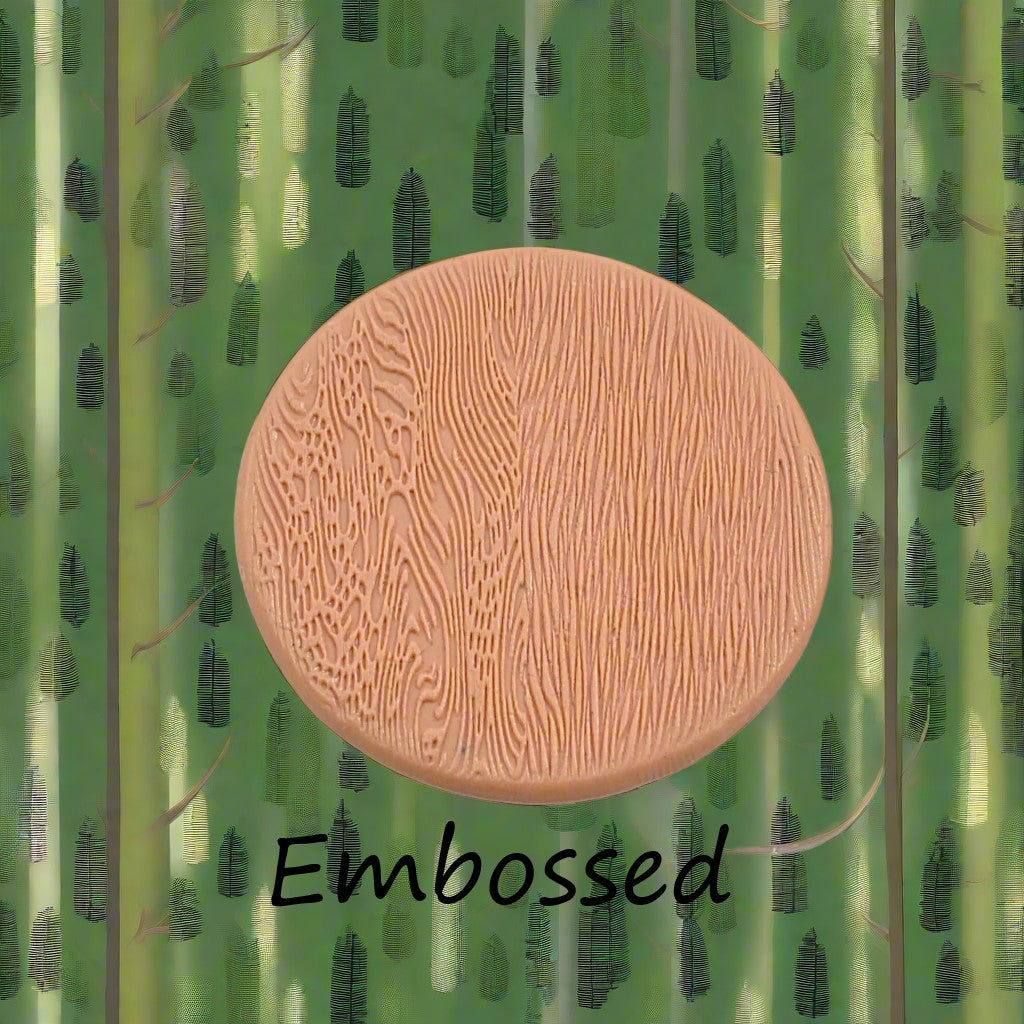Tree bark designs debossed in silly putty Using a embossed texture mat. This will give you an idea of what it will look like on metal clay or polymer clay.