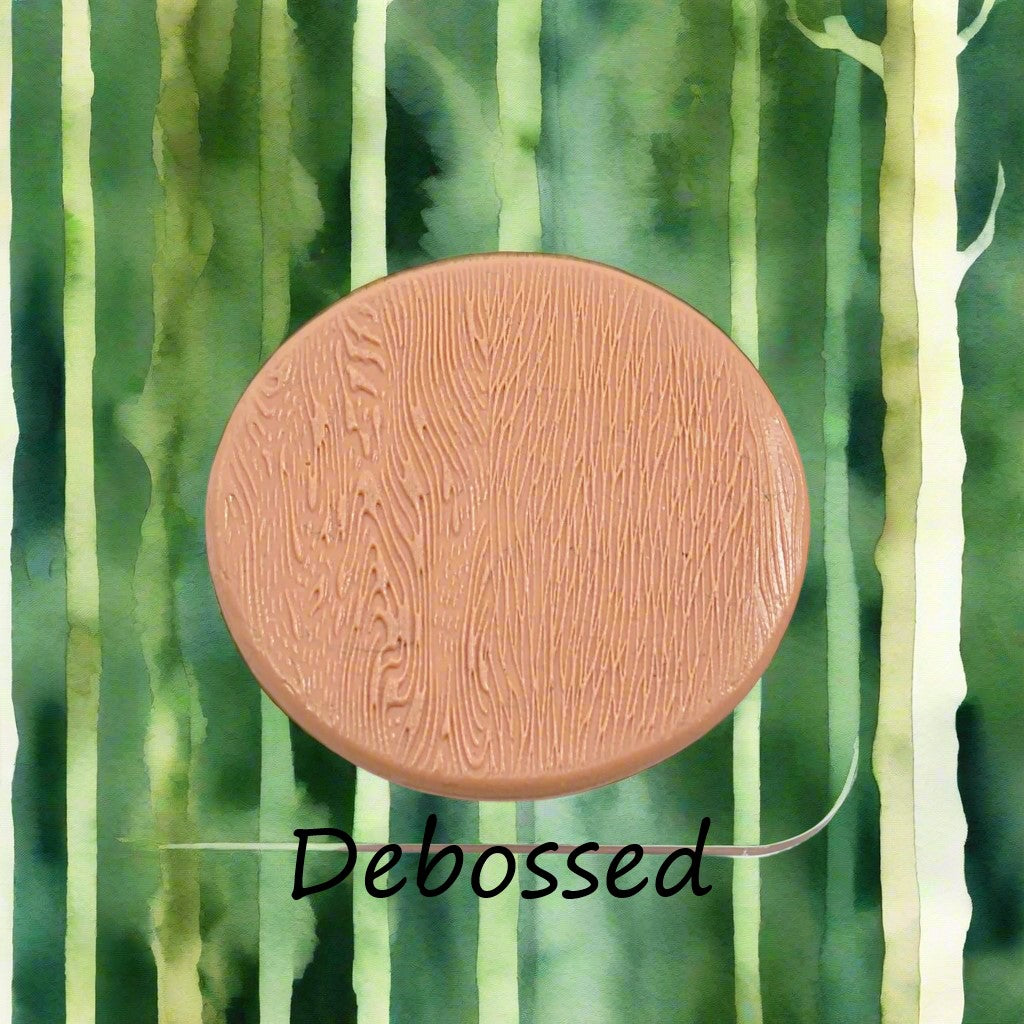 Tree bark designs embossed in silly putty Using a debossed texture mat. This will give you an idea of what it will look like on metal clay or polymer clay.