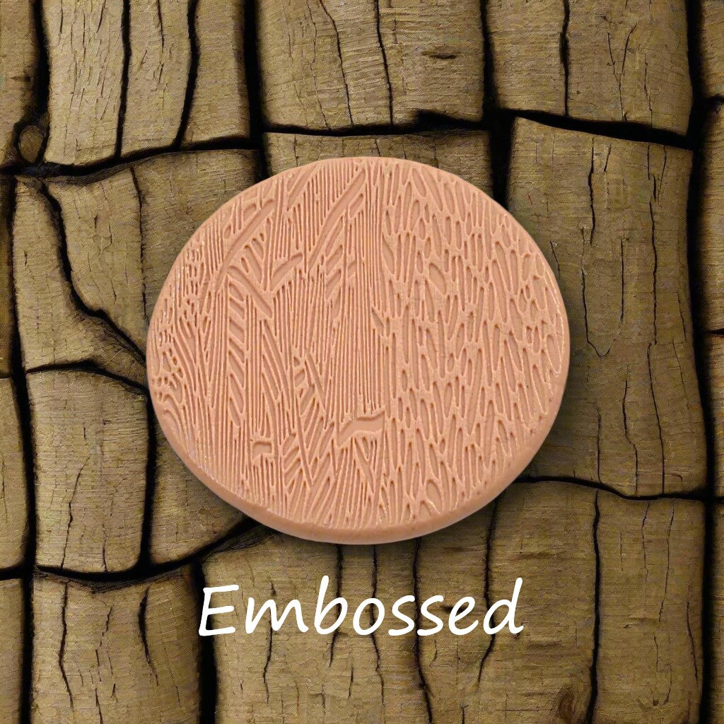 Tree bark designs debossed in silly putty Using a debossed texture mat. This will give you an idea of what it will look like on metal clay or polymer clay.
