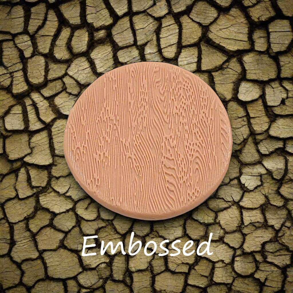 Tree bark designs debossed in silly putty Using a debossed texture mat. This will give you an idea of what it will look like on metal clay or polymer clay.