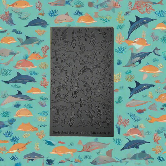 A texture tile debossed style of dolphins and sea life. Used with Art clay silver or other metal clay or polymer clay.