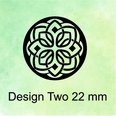 Circular design with leaf patterns on a green background, labeled 'Design Two 22 mm'.