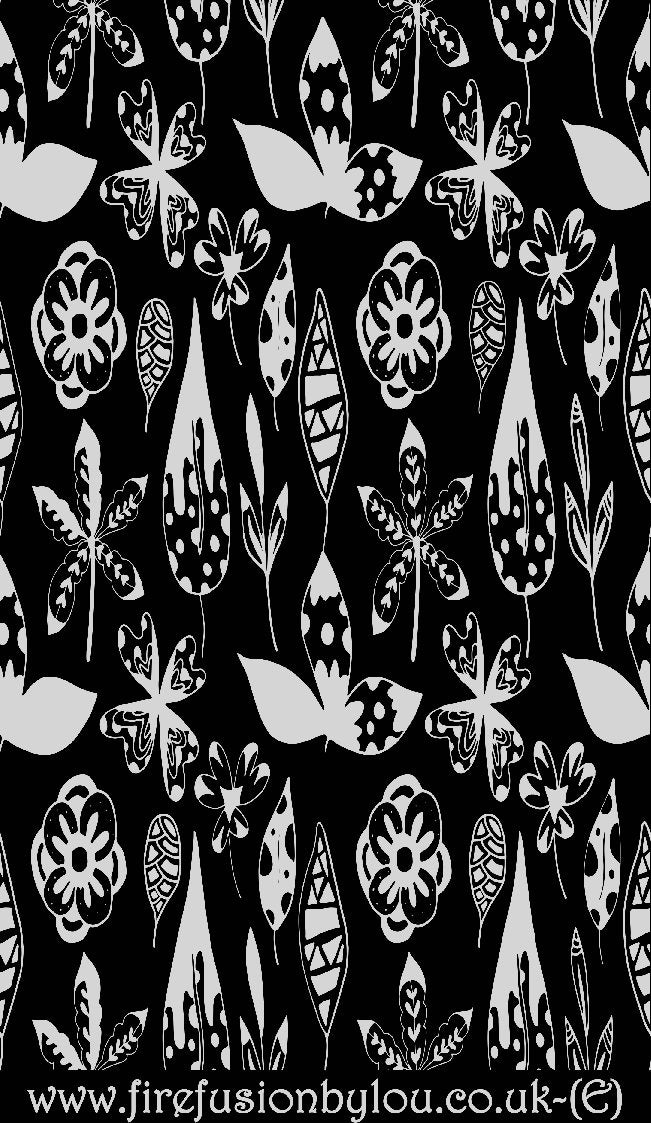 An embossed texture mat of flowers. This picture shows the texture mat pattern in black and white for use on metal clay or polymer clay.