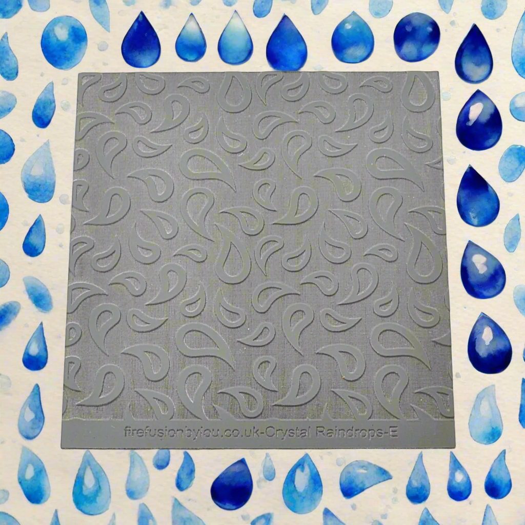 A raindrop pattern embossed texture mat in grey material. This texture mat will give you an debossed effect on metal clay or polymer clay.
