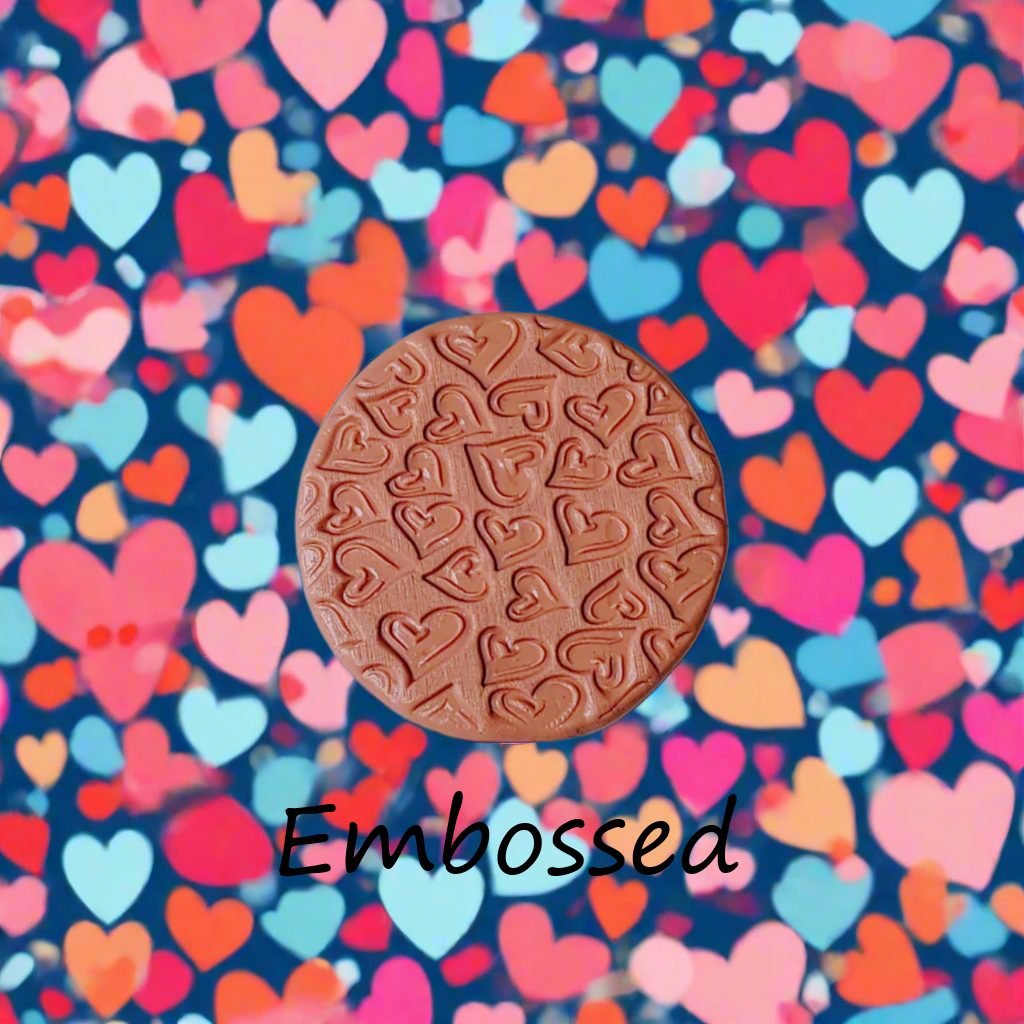 Confetti Hearts debossed in silly putty Using a embossed texture mat. This will give you an idea of what it will look like on metal clay or polymer clay