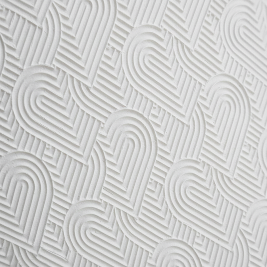 Close-up of a textured white surface with wavy line pattern