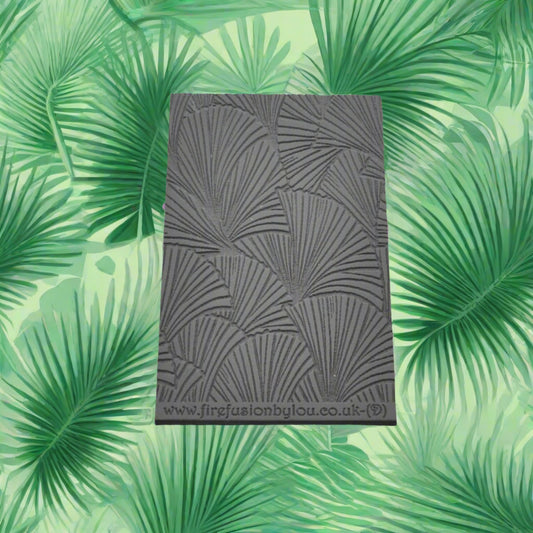 A 95 x 55 mm debossed texture mat with fan leaves. Use to make a embossed impression on metal clay and polymer clay.