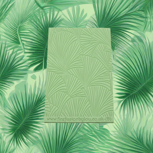 A 95 x 55 mm debossed texture mat with fan leaves. Use to make a embossed impression on metal clay and polymer clay.
