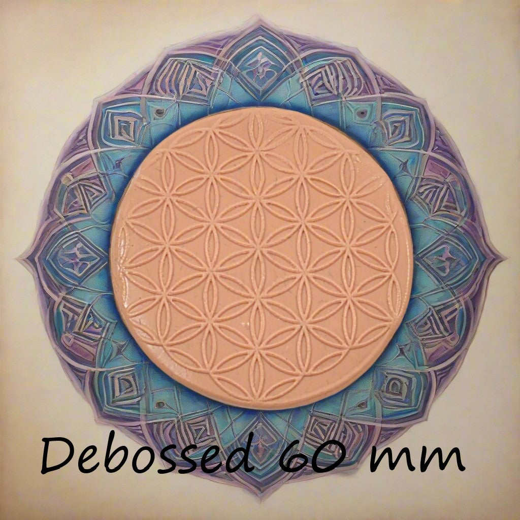 60 mm Flower of Life design embossed in silly putty Using a debossed texture mat. This will give you an idea of what it will look like on metal clay or polymer clay