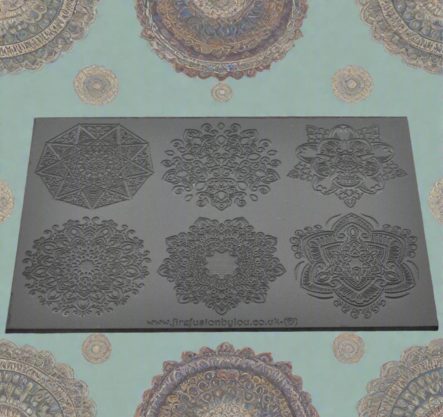 A texture mat debossed with six large mandala designs. Use to make a embossed impression on metal clay and polymer clay.