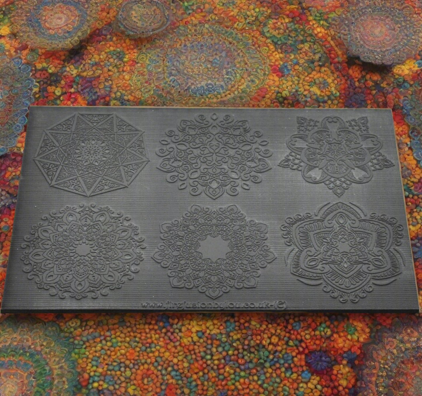 A texture mat embossed with six large mandala designs. Use to make a debossed impression on metal clay and polymer clay.