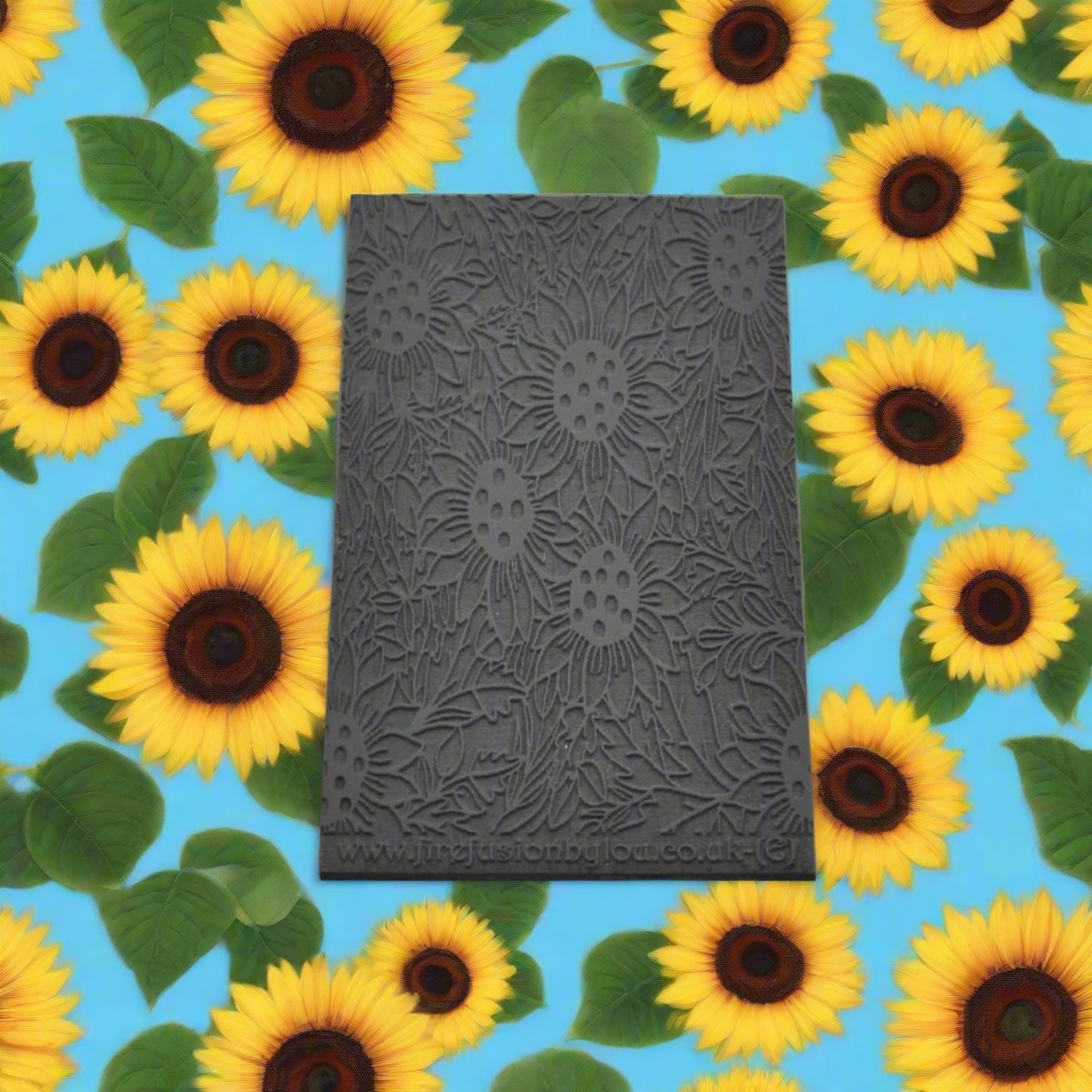 An embossed sunflower design texture mat will give a debossed texture design on metal clay and polymer