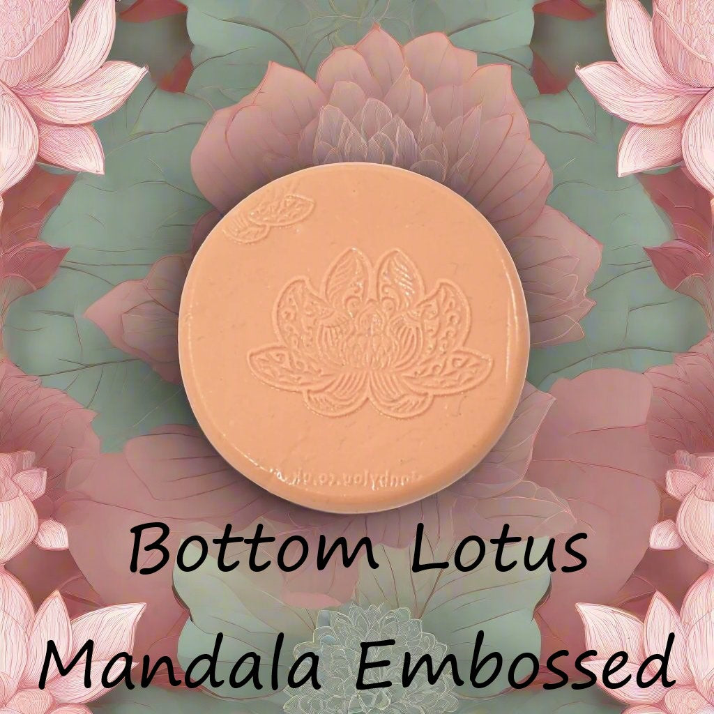 A lotus flower mandala debossed in silly putty Using a embossed texture mat in grey material. This will give you an idea of what it will look like on metal clay or polymer clay.