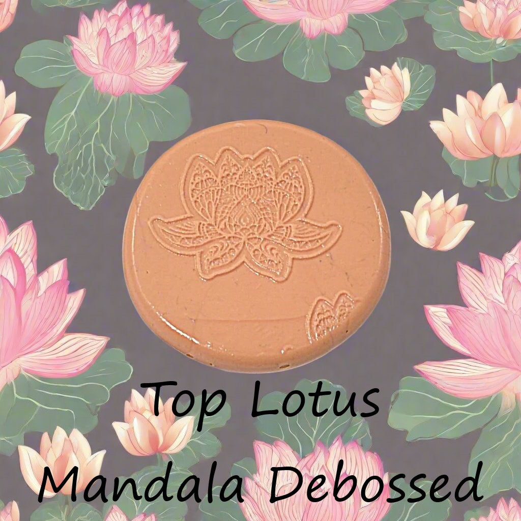 A lotus flower mandala embossed in silly putty Using a debossed texture mat in grey material. This will give you an idea of what it will look like on metal clay or polymer clay.