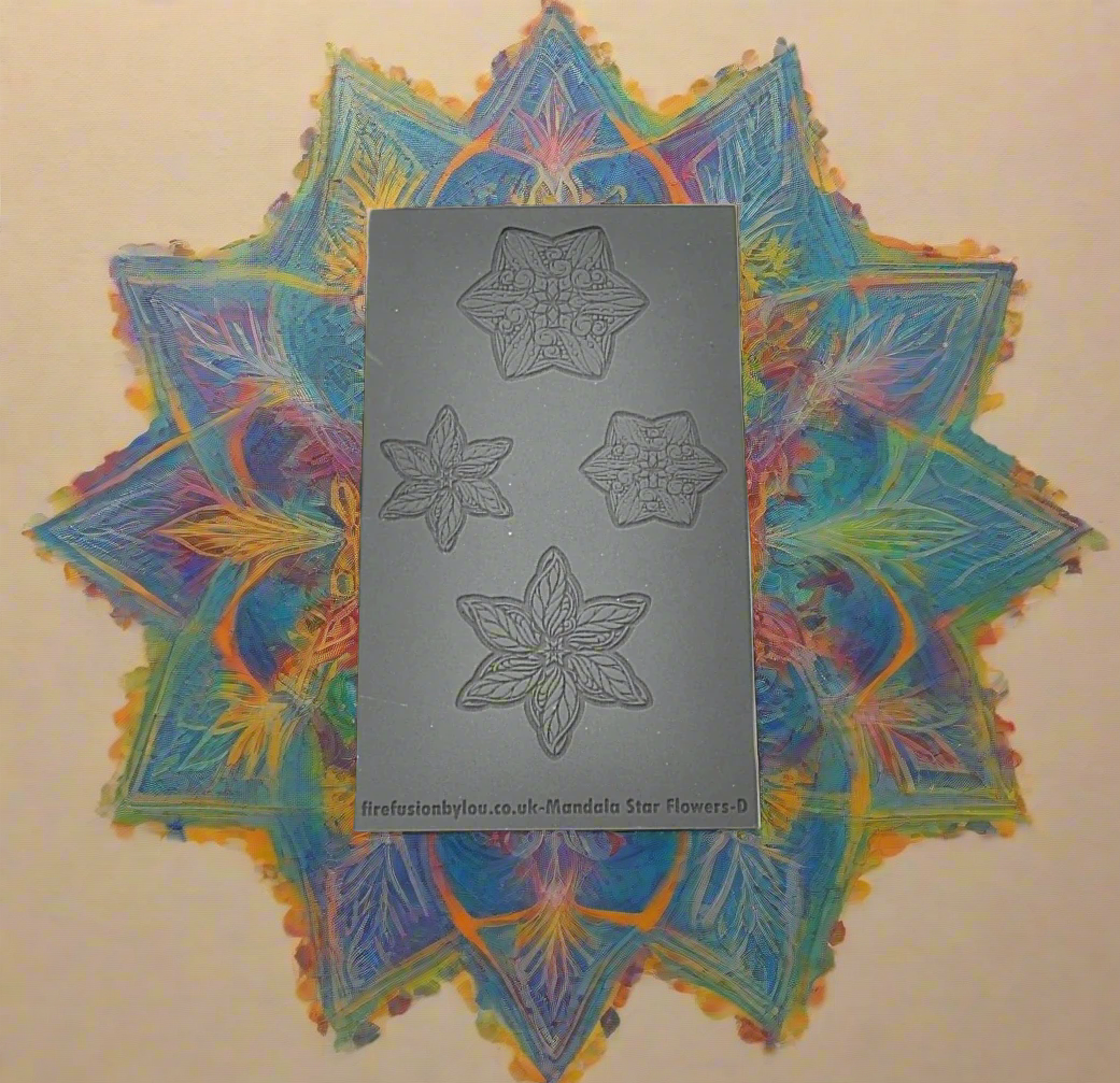 A debossed texture mat with mandala star flowers. Use to make an impression on metal clay and polymer clay.