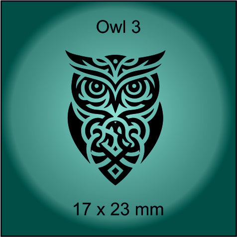 Decorative owl design with intricate patterns on a green background