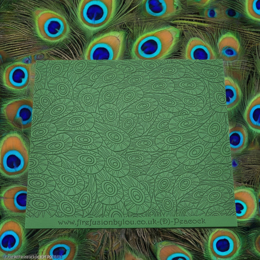 A peacock feather pattern debossed texture mat. This texture mat will give you an embossed effect on metal clay or polymer clay.