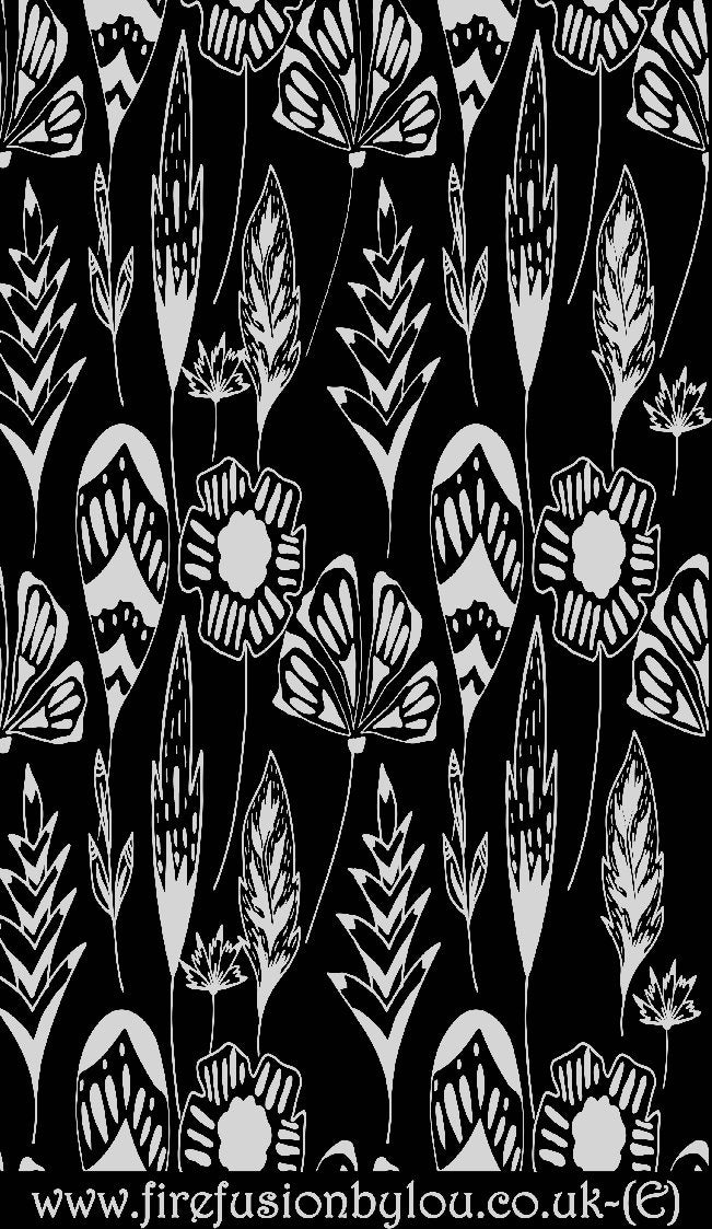 An embossed texture mat of flowers. This picture shows the texture mat pattern in black and white for use on metal clay or polymer clay.